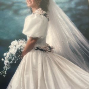 Size 4. Wedding Gown, Ivory Raw Silk with silk flowers purchased in Austria.